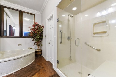 Enjoy timeless elegance and custom craftsmanship in this on Diamondhead Country Club in Mississippi - for sale on GolfHomes.com, golf home, golf lot