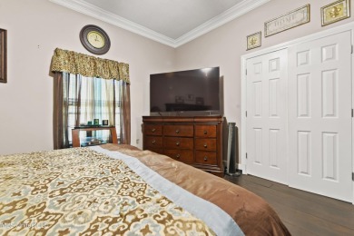 Enjoy timeless elegance and custom craftsmanship in this on Diamondhead Country Club in Mississippi - for sale on GolfHomes.com, golf home, golf lot