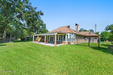 Enjoy timeless elegance and custom craftsmanship in this on Diamondhead Country Club in Mississippi - for sale on GolfHomes.com, golf home, golf lot