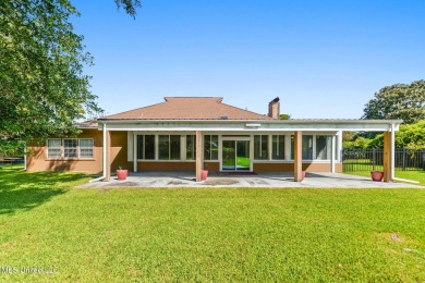 Enjoy timeless elegance and custom craftsmanship in this on Diamondhead Country Club in Mississippi - for sale on GolfHomes.com, golf home, golf lot