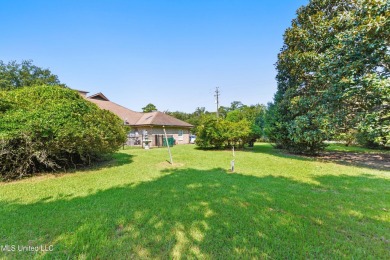 Enjoy timeless elegance and custom craftsmanship in this on Diamondhead Country Club in Mississippi - for sale on GolfHomes.com, golf home, golf lot