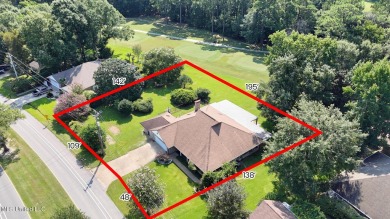 Enjoy timeless elegance and custom craftsmanship in this on Diamondhead Country Club in Mississippi - for sale on GolfHomes.com, golf home, golf lot