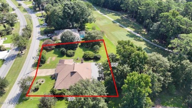 Enjoy timeless elegance and custom craftsmanship in this on Diamondhead Country Club in Mississippi - for sale on GolfHomes.com, golf home, golf lot
