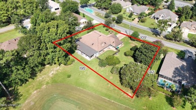 Enjoy timeless elegance and custom craftsmanship in this on Diamondhead Country Club in Mississippi - for sale on GolfHomes.com, golf home, golf lot