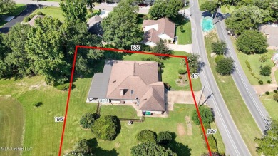 Enjoy timeless elegance and custom craftsmanship in this on Diamondhead Country Club in Mississippi - for sale on GolfHomes.com, golf home, golf lot