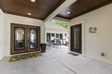 This amazing Mediterranean style home on the Egret 6th tee box on Carolina National Golf Club in North Carolina - for sale on GolfHomes.com, golf home, golf lot