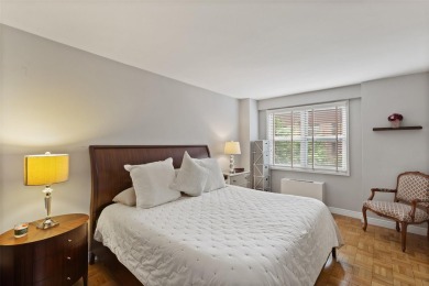 Enter through a welcoming foyer into a large living room on Leewood Golf Club in New York - for sale on GolfHomes.com, golf home, golf lot