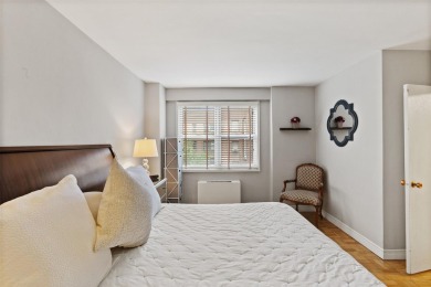 Enter through a welcoming foyer into a large living room on Leewood Golf Club in New York - for sale on GolfHomes.com, golf home, golf lot