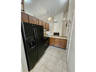 Spacious 2/2 condo with bonus room and covered balcony on on Hilaman Park Golf Course in Florida - for sale on GolfHomes.com, golf home, golf lot