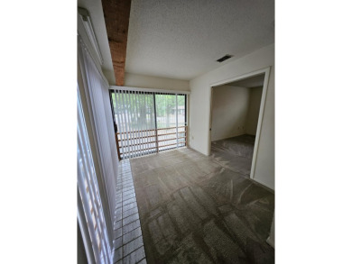 Spacious 2/2 condo with bonus room and covered balcony on on Hilaman Park Golf Course in Florida - for sale on GolfHomes.com, golf home, golf lot