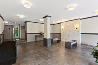 Enter through a welcoming foyer into a large living room on Leewood Golf Club in New York - for sale on GolfHomes.com, golf home, golf lot