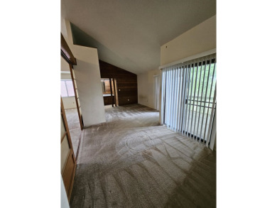 Spacious 2/2 condo with bonus room and covered balcony on on Hilaman Park Golf Course in Florida - for sale on GolfHomes.com, golf home, golf lot