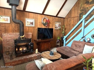 Your Forest Retreat: Enchanting Chalet in The Hideout 3 Bedrooms on The Hideout Golf in Pennsylvania - for sale on GolfHomes.com, golf home, golf lot