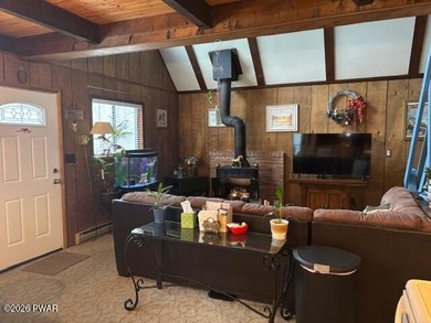 Your Forest Retreat: Enchanting Chalet in The Hideout 3 Bedrooms on The Hideout Golf in Pennsylvania - for sale on GolfHomes.com, golf home, golf lot