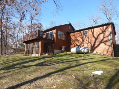 Discover the charm of this four-bedroom, cabin-style home in on Apple Canyon Lake Golf Course in Illinois - for sale on GolfHomes.com, golf home, golf lot