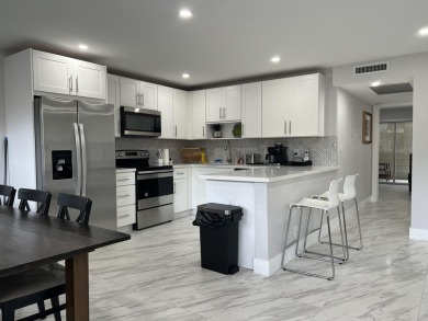 WELCOME HOME TO YOUR 2/2 TURNKEY, COMPLETELY RENOVATED on Wynmoor Golf Course in Florida - for sale on GolfHomes.com, golf home, golf lot