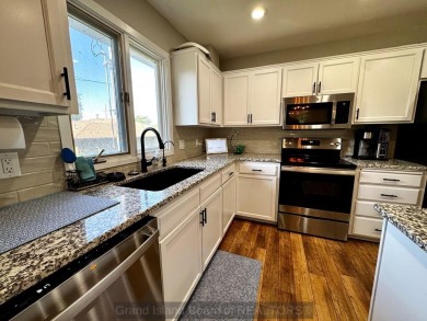 This charming home sits on a large lot with mature trees on the on Indianhead Golf Club in Nebraska - for sale on GolfHomes.com, golf home, golf lot