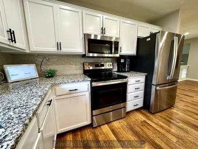 This charming home sits on a large lot with mature trees on the on Indianhead Golf Club in Nebraska - for sale on GolfHomes.com, golf home, golf lot