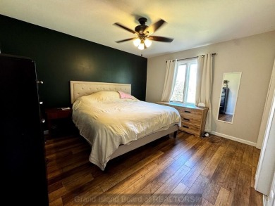 This charming home sits on a large lot with mature trees on the on Indianhead Golf Club in Nebraska - for sale on GolfHomes.com, golf home, golf lot