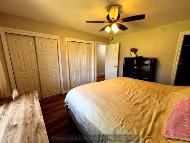 This charming home sits on a large lot with mature trees on the on Indianhead Golf Club in Nebraska - for sale on GolfHomes.com, golf home, golf lot