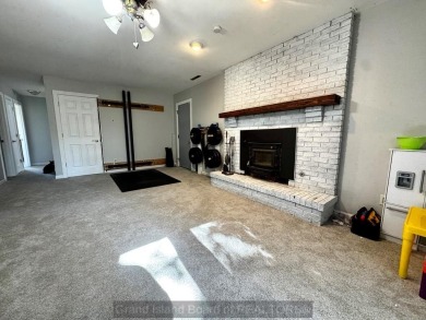 This charming home sits on a large lot with mature trees on the on Indianhead Golf Club in Nebraska - for sale on GolfHomes.com, golf home, golf lot