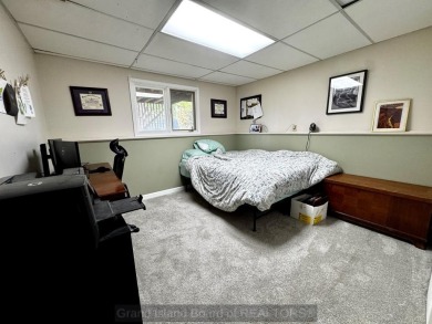 This charming home sits on a large lot with mature trees on the on Indianhead Golf Club in Nebraska - for sale on GolfHomes.com, golf home, golf lot
