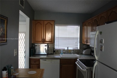 Dont miss this stunning 55+ community property, remodeled on Sunrise Lakes Phase IV Golf Course in Florida - for sale on GolfHomes.com, golf home, golf lot