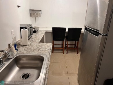 Come home to a truly unique one-bedroom end unit with stunning on Inverrary Country Club in Florida - for sale on GolfHomes.com, golf home, golf lot