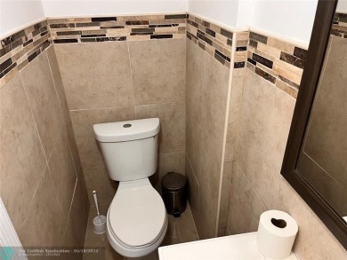 Come home to a truly unique one-bedroom end unit with stunning on Inverrary Country Club in Florida - for sale on GolfHomes.com, golf home, golf lot