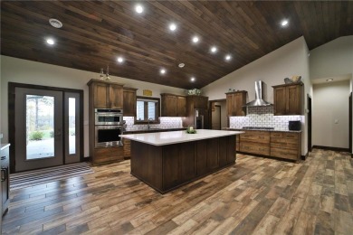 Don't miss this three-bedroom, four-bath custom-built home. Home on Blueberry Pines Golf CLub in Minnesota - for sale on GolfHomes.com, golf home, golf lot
