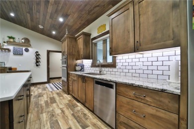 Don't miss this three-bedroom, four-bath custom-built home. Home on Blueberry Pines Golf CLub in Minnesota - for sale on GolfHomes.com, golf home, golf lot