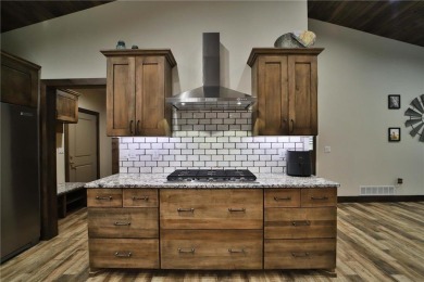 Don't miss this three-bedroom, four-bath custom-built home. Home on Blueberry Pines Golf CLub in Minnesota - for sale on GolfHomes.com, golf home, golf lot