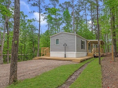 Nestled among the pines, this charming 2-bedroom, 2-bath turnkey on Rayburn Country Club in Texas - for sale on GolfHomes.com, golf home, golf lot