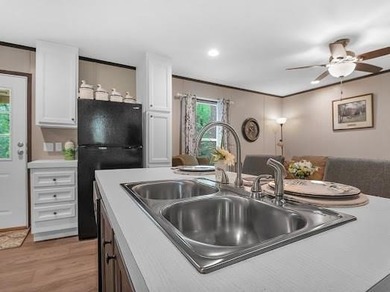 Nestled among the pines, this charming 2-bedroom, 2-bath turnkey on Rayburn Country Club in Texas - for sale on GolfHomes.com, golf home, golf lot