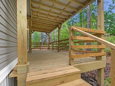 Nestled among the pines, this charming 2-bedroom, 2-bath turnkey on Rayburn Country Club in Texas - for sale on GolfHomes.com, golf home, golf lot