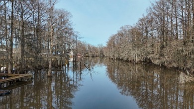 Look at this stunning home on Bayou Desiard in Frenchmen's Bend on Frenchmans Bend Country Club in Louisiana - for sale on GolfHomes.com, golf home, golf lot