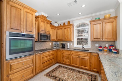 This all-brick, custom-built home sits on a level lot on on Granada Golf Course in Arkansas - for sale on GolfHomes.com, golf home, golf lot