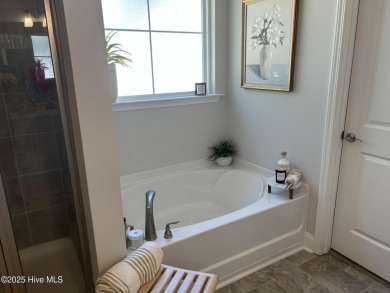 This home was built in 2024; it's practically brand new! The on Harbour Point Golf Club in North Carolina - for sale on GolfHomes.com, golf home, golf lot
