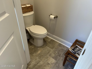 This home was built in 2024; it's practically brand new! The on Harbour Point Golf Club in North Carolina - for sale on GolfHomes.com, golf home, golf lot