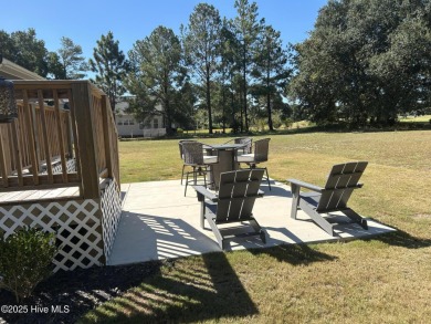 This home was built in 2024; it's practically brand new! The on Harbour Point Golf Club in North Carolina - for sale on GolfHomes.com, golf home, golf lot