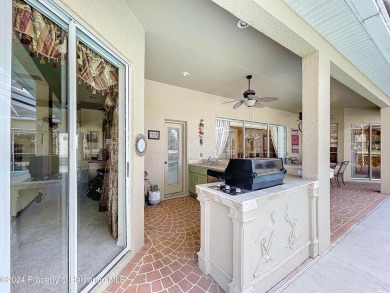 Beautifully situated 3+/3/3 pool home in upscale Silverthorn on Silverthorn Country Club in Florida - for sale on GolfHomes.com, golf home, golf lot