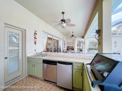 Beautifully situated 3+/3/3 pool home in upscale Silverthorn on Silverthorn Country Club in Florida - for sale on GolfHomes.com, golf home, golf lot