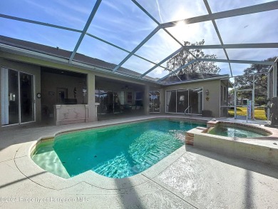 Beautifully situated 3+/3/3 pool home in upscale Silverthorn on Silverthorn Country Club in Florida - for sale on GolfHomes.com, golf home, golf lot