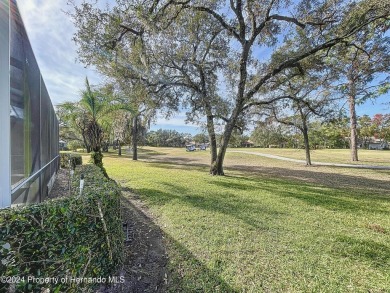 Beautifully situated 3+/3/3 pool home in upscale Silverthorn on Silverthorn Country Club in Florida - for sale on GolfHomes.com, golf home, golf lot