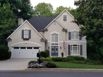 Tucked into a quiet cul-de-sac in sought-after Windward, this on The Golf Club of Georgia in Georgia - for sale on GolfHomes.com, golf home, golf lot