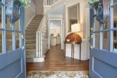 Tucked into a quiet cul-de-sac in sought-after Windward, this on The Golf Club of Georgia in Georgia - for sale on GolfHomes.com, golf home, golf lot