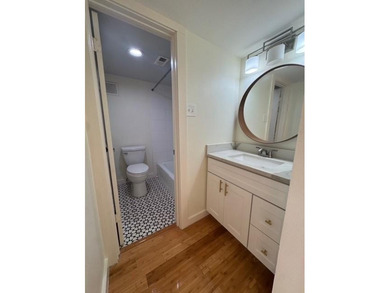 This modern updated condo offers quartz counters, cement tile on Las Colinas Country Club in Texas - for sale on GolfHomes.com, golf home, golf lot