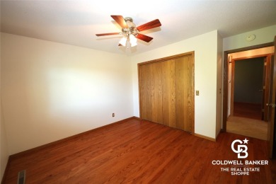 Enjoy peaceful evenings on your covered back deck overlooking on The Golf Club At Southwind in Kansas - for sale on GolfHomes.com, golf home, golf lot