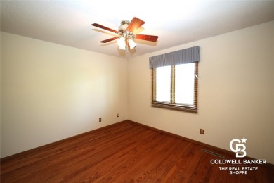 Enjoy peaceful evenings on your covered back deck overlooking on The Golf Club At Southwind in Kansas - for sale on GolfHomes.com, golf home, golf lot