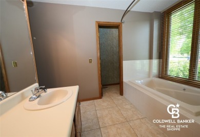 Enjoy peaceful evenings on your covered back deck overlooking on The Golf Club At Southwind in Kansas - for sale on GolfHomes.com, golf home, golf lot